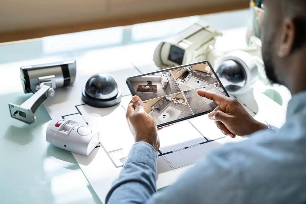 Picture of a Man Looking at a monitor with Hidden Camera Views in Los Angeles